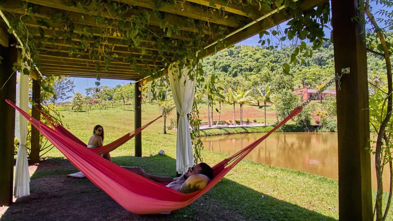 Hotel Boutique Frangipani Brotas Exterior photo Hammock in the shade