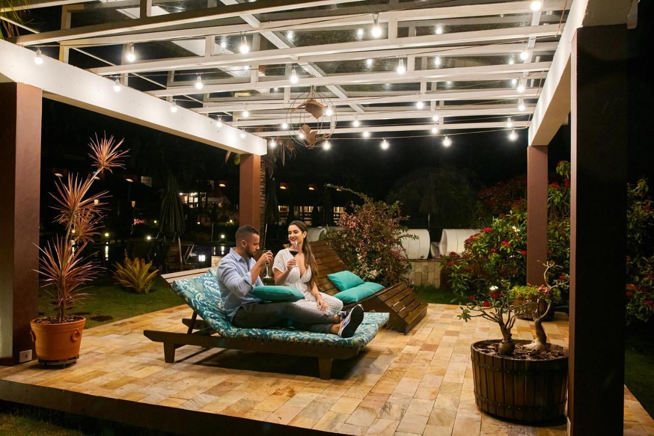 Hotel Boutique Frangipani Brotas Exterior photo A pergola with a retractable roof