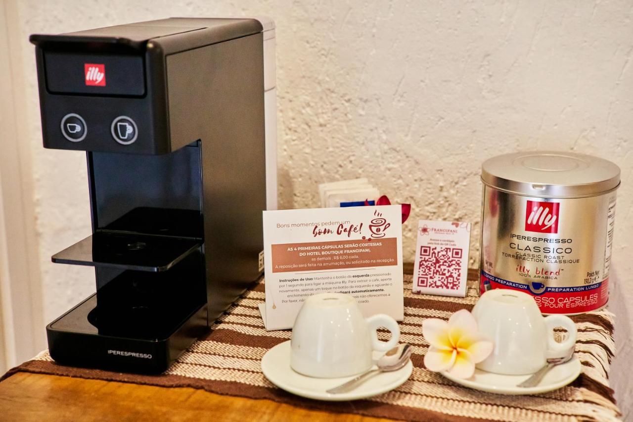 Hotel Boutique Frangipani Brotas Exterior photo A single serve coffee machine