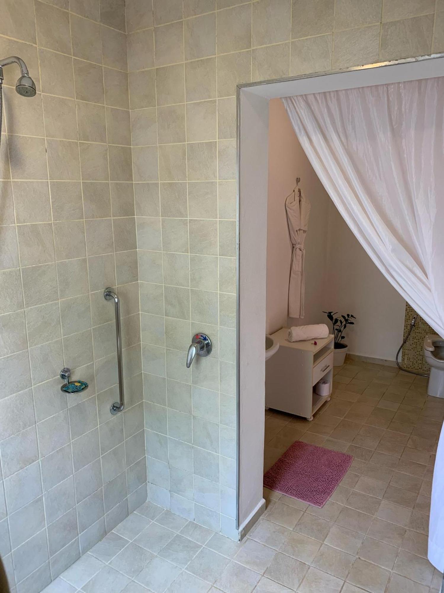 Hotel Boutique Frangipani Brotas Exterior photo A shower cubicle