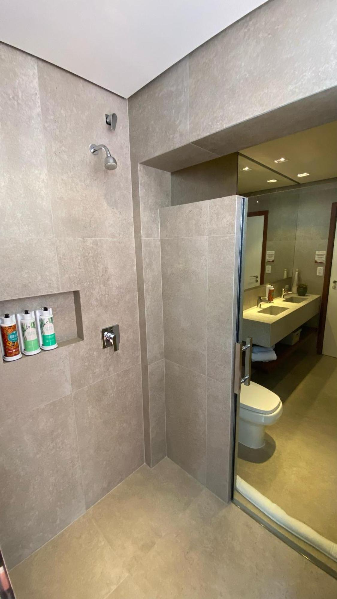 Hotel Boutique Frangipani Brotas Exterior photo A shower door