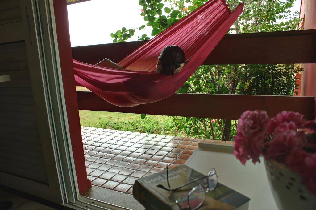 Hotel Boutique Frangipani Brotas Exterior photo A hammock on a balcony